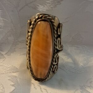 Light amber stone, silver tone adjustable ring.